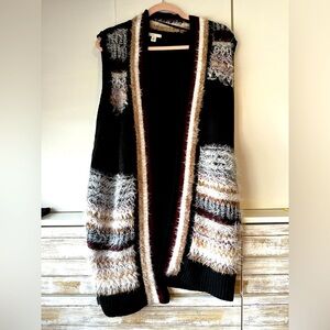 Long knitted vest.Made by EST. 1949. Size medium.Very soft. Excellent condition.